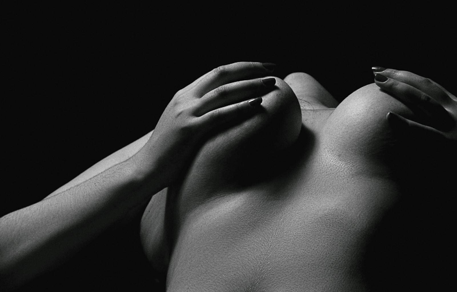 Grayscale Photo of Woman's Chest